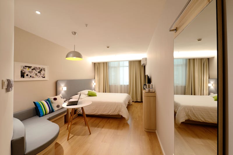 Modern hotel room representative of Choice Hotels properties